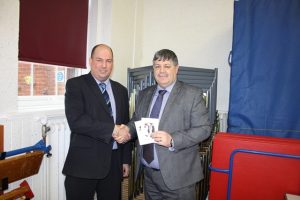 Mr. Payne is presented with a £150 Amazon voucher by Stage Systems Business Manager, Ian